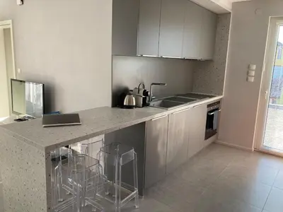 Cuisine ou kitchenette dans l'établissement La Suite des Maraîchers