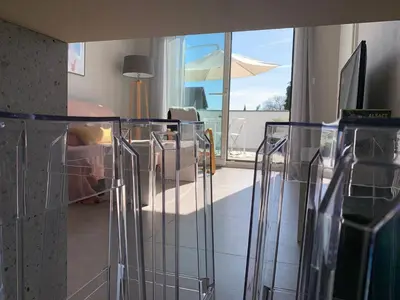 Télévision ou salle de divertissement dans l'établissement La Suite des Maraîchers