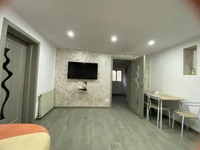 Télévision ou salle de divertissement dans l'établissement Au refuge de David et Leah