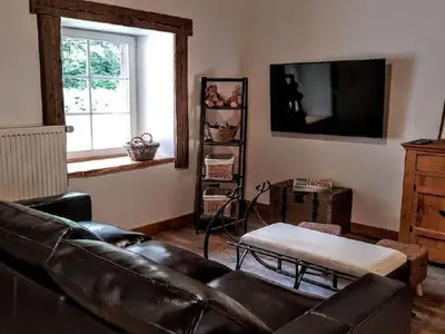Télévision ou salle de divertissement dans l'établissement Holiday Home Le Pré des Biches by Interhome