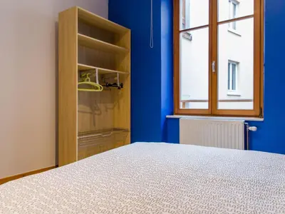 Un ou plusieurs lits dans un hébergement de l'établissement Apartment mit zwei Garagenstellplätzen by Interhome