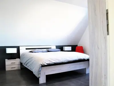 Un ou plusieurs lits dans un hébergement de l'établissement Maison familiale spacieuse, animaux acceptés à Oberentzen - FR-1-744-51