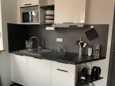 Cuisine ou kitchenette dans l'établissement Studio 3 étoiles avec grand JACUZZI PRIVÉ