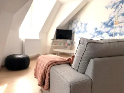 Coin salon dans l'établissement Cozy Apartment city center