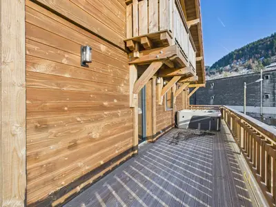 Balcon ou terrasse dans l'établissement Le Chalet des Chéneaux - Neuf avec Jacuzzi