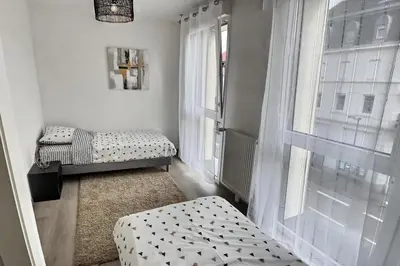 Un ou plusieurs lits dans un hébergement de l'établissement Duplex 70 sqm 5mn from Basel 1 free parking