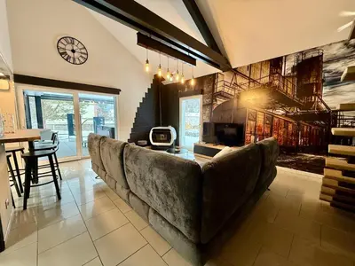 Coin salon dans l'établissement Notre Écrin Vosgien - Gîte de prestige, SPA & jeux