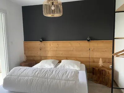 Un ou plusieurs lits dans un hébergement de l'établissement Appartement avec jardin privatif Gérardmer