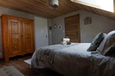 Un ou plusieurs lits dans un hébergement de l'établissement Maison d'hôtes Les Roches Fleuries