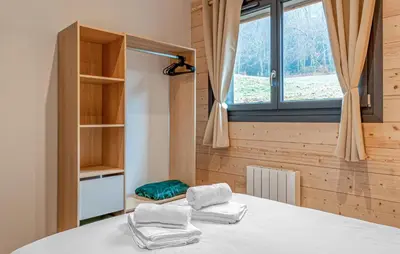 Un ou plusieurs lits dans un hébergement de l'établissement Confortable Chalet Moderne