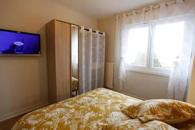 Un ou plusieurs lits dans un hébergement de l'établissement Gîte les Lilas Blancs