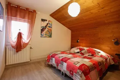 Un ou plusieurs lits dans un hébergement de l'établissement Gîte les Lilas Blancs
