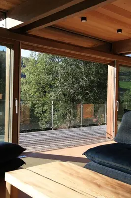 Coin salon dans l'établissement Fleur des Vosges Chalet, panorama of La Bresse
