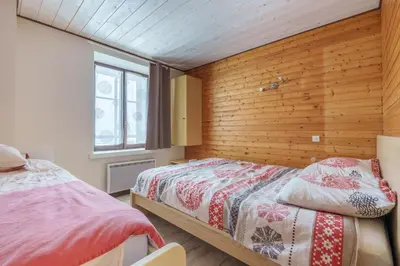 Un ou plusieurs lits dans un hébergement de l'établissement Le Régit - Proche Station de Ski