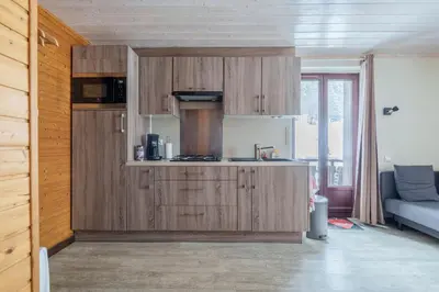 Cuisine ou kitchenette dans l'établissement Le Régit - Proche Station de Ski