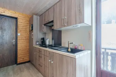 Cuisine ou kitchenette dans l'établissement Le Régit - Proche Station de Ski