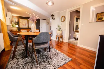 Coin salon dans l'établissement Appartement cosy avec jardin privatif classé 4 étoiles
