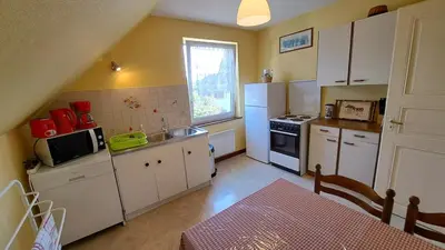 Cuisine ou kitchenette dans l'établissement Au cœur de l'Alsace