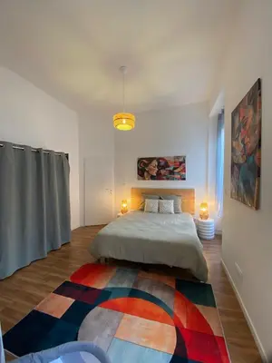 Un ou plusieurs lits dans un hébergement de l'établissement Bright and spacious apartment, Belfort center