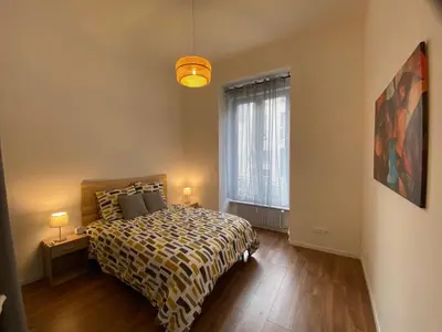 Un ou plusieurs lits dans un hébergement de l'établissement Bright and spacious apartment, Belfort center
