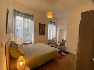 Un ou plusieurs lits dans un hébergement de l'établissement Bright and spacious apartment, Belfort center