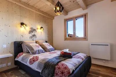 Un ou plusieurs lits dans un hébergement de l'établissement Chalet Bellevue - Jacuzzi Privé