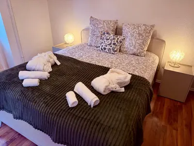Un ou plusieurs lits dans un hébergement de l'établissement Le Cosy Home