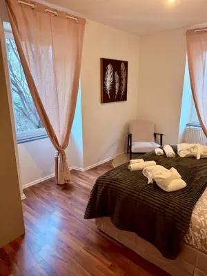 Un ou plusieurs lits dans un hébergement de l'établissement Le Cosy Home