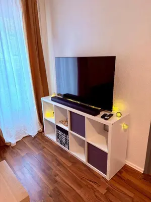 Télévision ou salle de divertissement dans l'établissement Le Cosy Home
