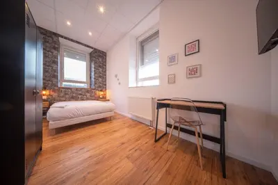 Un ou plusieurs lits dans un hébergement de l'établissement Le Bateau d'Alma Chic apartment for 6 people