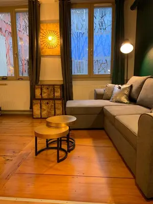 Coin salon dans l'établissement Appartements des 2 Têtes