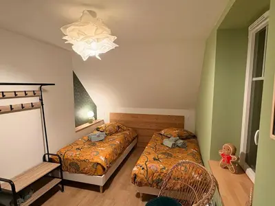 Un ou plusieurs lits dans un hébergement de l'établissement La Maison des Maraichers