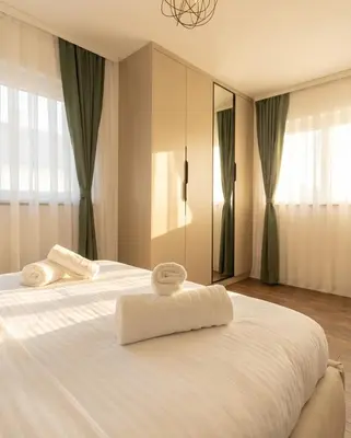 Un ou plusieurs lits dans un hébergement de l'établissement Le Lounge-Prestige Residence Euroairport