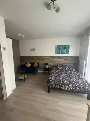 Un ou plusieurs lits dans un hébergement de l'établissement Studio au coeur du Vignoble