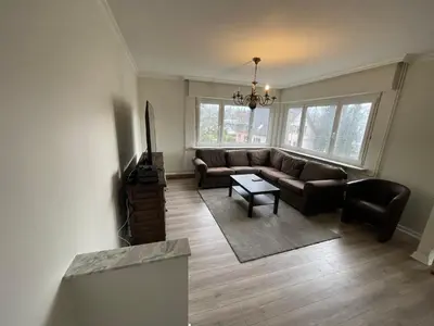 Coin salon dans l'établissement Grand appartement entouré de verdure