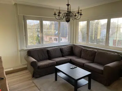 Coin salon dans l'établissement Grand appartement entouré de verdure