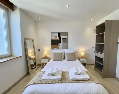 Un ou plusieurs lits dans un hébergement de l'établissement Hyper centre 6 pers 2 chambres 2 salle de bain