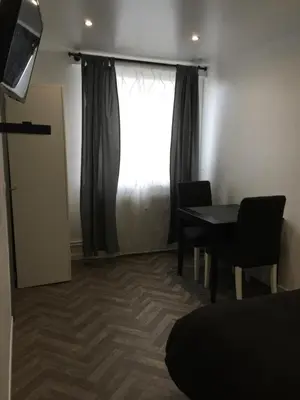 Coin salon dans l'établissement Cozy studio face Gare tgv Mulhouse