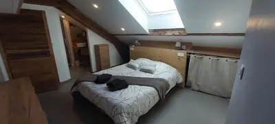 Un ou plusieurs lits dans un hébergement de l'établissement Spacieux duplex avec terrasse très apprécié des voyageurs au cœur de la Bresse - de 2 à 8 personnes