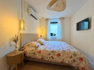 Un ou plusieurs lits dans un hébergement de l'établissement T2 design terrasse, Climatisé, Netflix