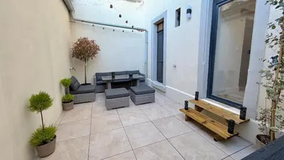 Coin salon dans l'établissement T2 design terrasse, Climatisé, Netflix