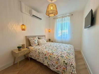 Un ou plusieurs lits dans un hébergement de l'établissement Appartement, climatisé, Netflix, centre