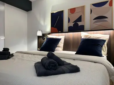 Un ou plusieurs lits dans un hébergement de l'établissement Appartement avec garage - 5mn aéroport Bâle