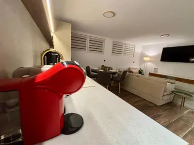 Coin salon dans l'établissement Appartement avec garage - 5mn aéroport Bâle