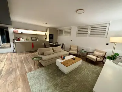 Coin salon dans l'établissement Appartement avec garage - 5mn aéroport Bâle
