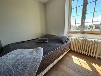 Un ou plusieurs lits dans un hébergement de l'établissement Appartement proche Mulhouse, free parking