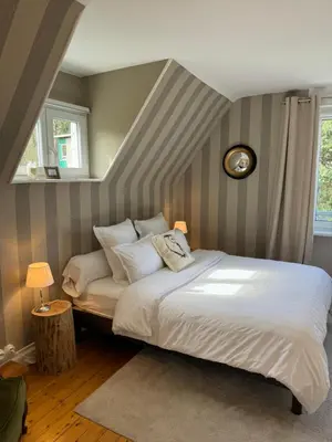 Un ou plusieurs lits dans un hébergement de l'établissement Chambre d hote de charme