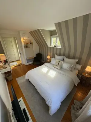 Un ou plusieurs lits dans un hébergement de l'établissement Chambre d hote de charme