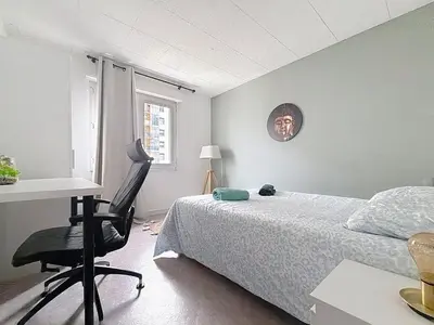 Un ou plusieurs lits dans un hébergement de l'établissement Appartement calme avec 2 chambres parking gratuit