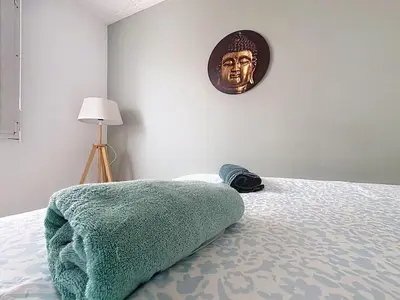 Un ou plusieurs lits dans un hébergement de l'établissement Appartement calme avec 2 chambres parking gratuit